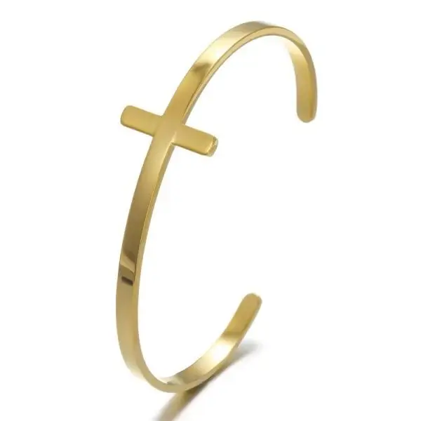 Gold and silver wide cuff bracelets on display