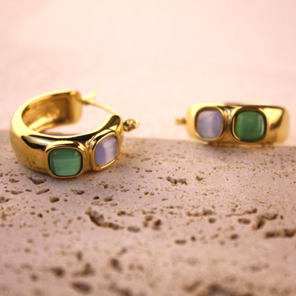 Chunky gold hoop earrings with green and lavender stones