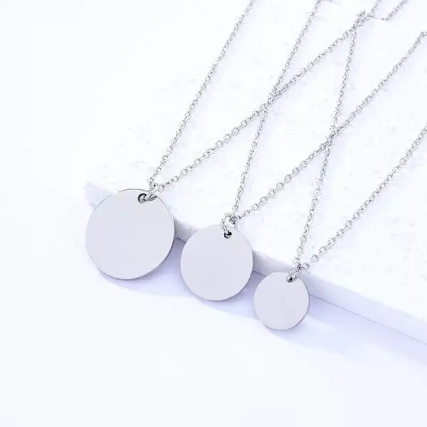 custom engraved round disc pendant necklace in gold, silver, and rose gold