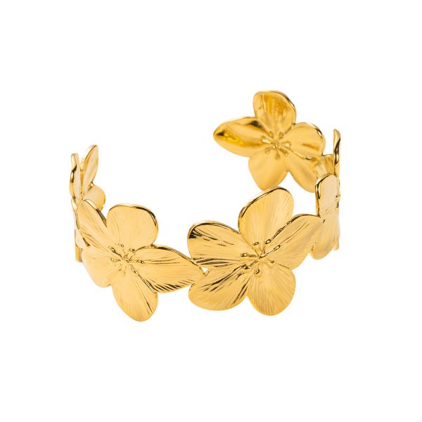 Gold flower cuff bracelet with textured petals and wide band, made using hydraulic press jewelry process